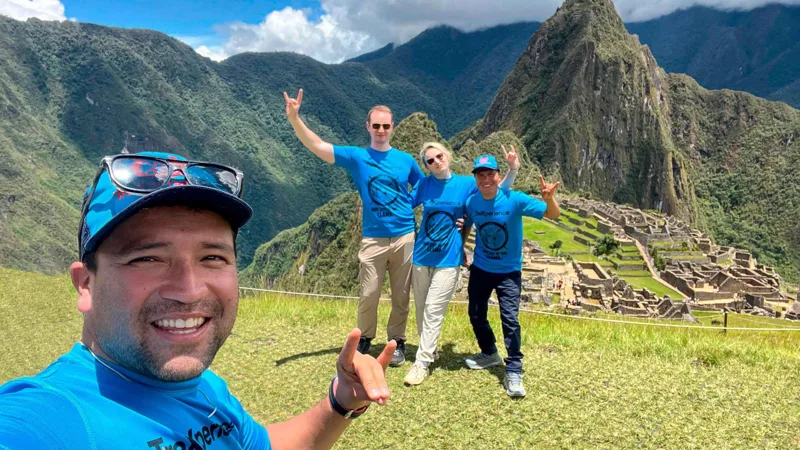 Hikers heading to the Sun Gate on a 4-day Inca Trail tour with a panoramic train back to Cusco, Peru